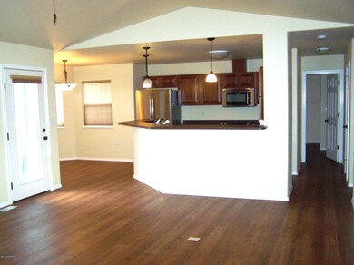 Open living area with vaulted ceiling