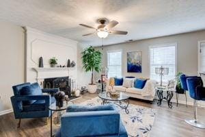 Living room with wood finished floors, ceiling fan
