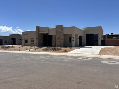View of front 3-car garage, concrete driveway, and stone siding