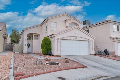 Mediterranean / spanish-style home featuring a gate, driveway, stucco siding, a garage, and a tile roof
