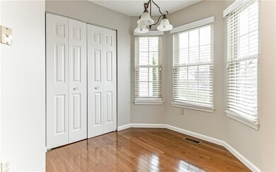 Dining nook with bay window brings all the natural