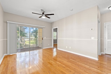 Unfurnished room with a ceiling fan and wood finished floors