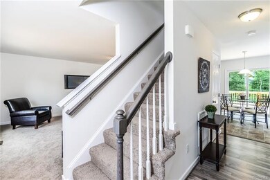 Foyer looking into eat in kitchen and family room