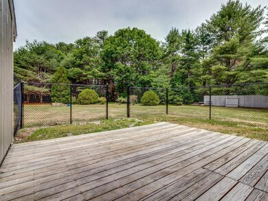 Fenced in area of back yard with...