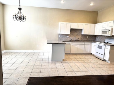 Ample dining area and counter seating off of kitchen.