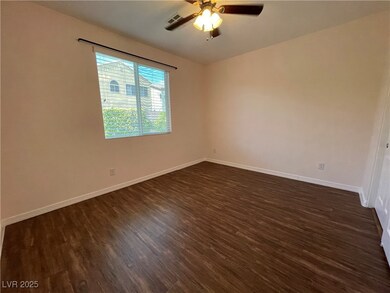 Unfurnished room with dark wood-style flooring, a