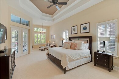 MASTER BEDROOM WITH SITTING AREA HAS FRENCH DOORS 