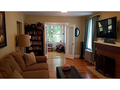 Living Room. Beautiful french doors lead to sunroo