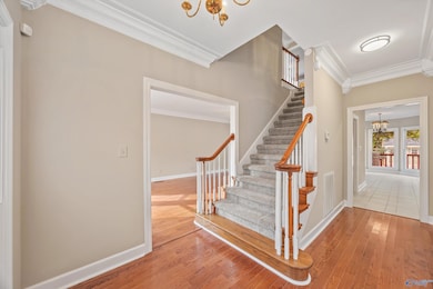 Large entryway with stairs leading to second level.