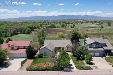 Aerial view of property including Pikes Peak!