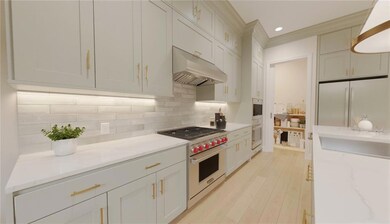 Kitchen featuring premium stove, under cabinet ran