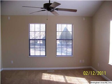 Master bedroom with new carpeting and cathedral ce