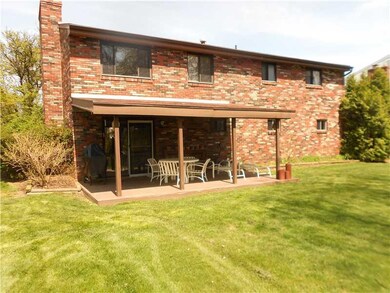 Exterior Back. Great covered patio leads to flat b