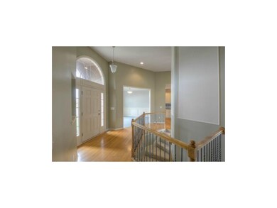 Impressive entryway with wrought iron spindles and
