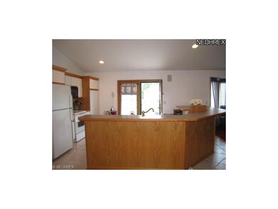 Large center island with breakfast bar.