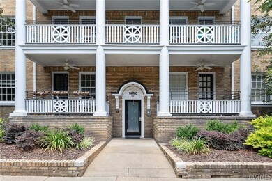 Entrance to property with ceiling fan and a balcon