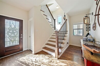 Beautiful entryway with attractive staircase and l