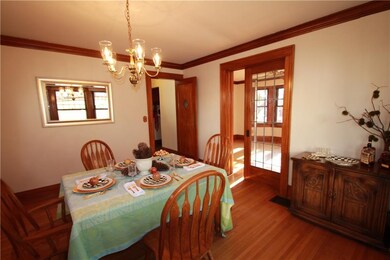 Note the stunning leaded glass pocket door.
