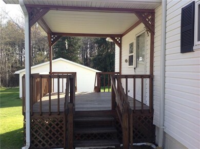 Covered side porch off of laundry room & kitchen