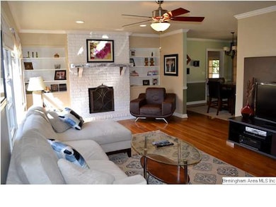 Large Living Room boasts updated ceiling fan and l