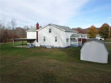 Exterior Back. 1 car attached garage, as well as a