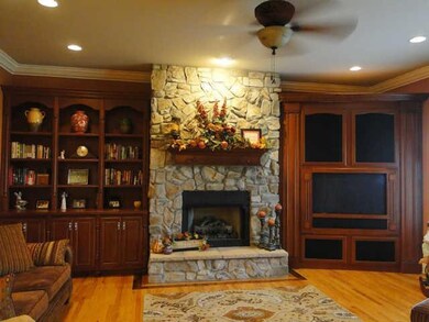 Fireplace in the great room is made of Colorado stone with 3 different mixes.  Big screen TV and Cherry built-ins.  Pull outs for convenience.  Surround sound.