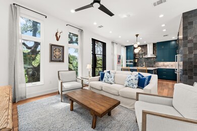 Living room featuring light wood-style floors, pl
