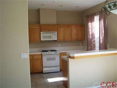 Open kitchen and bar as seen from dining area.  No