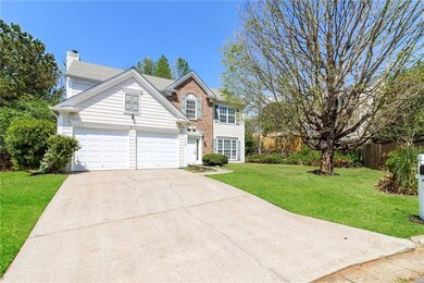 View of front facade featuring a front yard, a chi