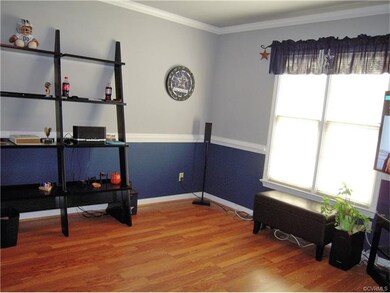 Living Room with Chair Rail, Ceiling Fan and Wood 