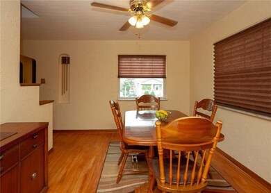 The hardwood flooring is continued in the dining r