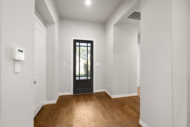 8' leaded glass door entry into the open foyer.