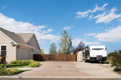 Driveway and 28' X 36' gated storage area plus 10X