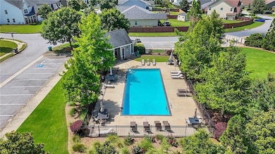 Aerial perspective of suburban area with a pool area