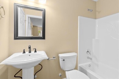 Bathroom featuring  shower combination and toilet