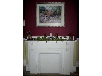 Living Room. The decorative fireplace adds warmth 
