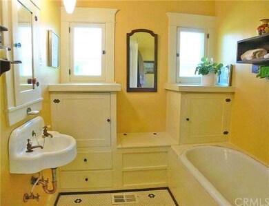 Oh-so-charming bathroom with original sink and cab