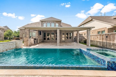 This photo showcases a beautiful brick home with a