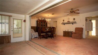 Front door is on the right. Door on left leads to a screened in porch.
