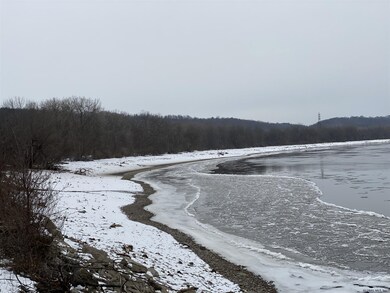 Walk of riverbank to get to property.