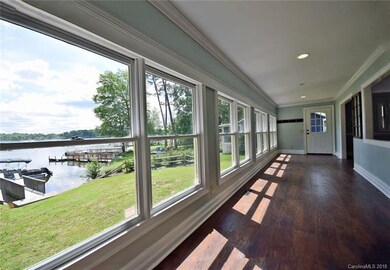 sit in your large sunroom and gaze at the lake thr