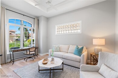 Den with ceiling fan, shiplap board tray ceiling,
