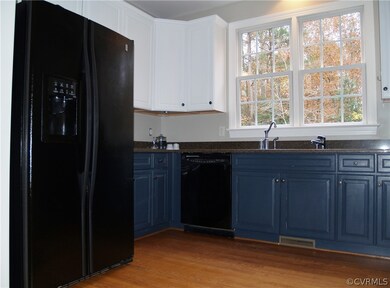 Raised Panel Custom Cabinets in Kitchen
