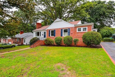 View of front of property featuring a front lawn w