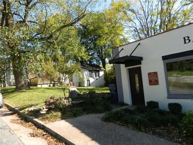 The vacant lot between the home and Bailey Law Firm is part of this property for sale.  All kinds of potential and possibilities.