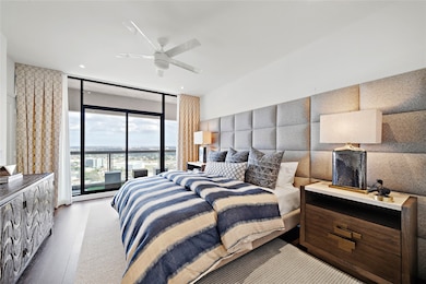 The large bedroom easily fits a king bed and has balcony access.