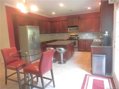 Generous Size Kitchen with Island and Recessed Lig