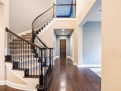 Foyer with stairway, hardwood / wood-style floori
