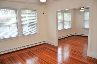 Living room extends to a formal dining room which