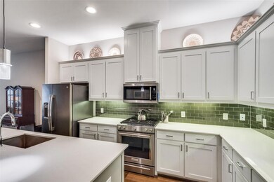 Chef's kitchen with high ceilings, recessed lighti